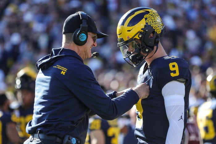 Michigan coach Jim Harbaugh talks to quarterback J.J. McCarthy before the start of the Rose Bowl vs. Alabama in Pasadena, California, on Monday, Jan. 1, 2024